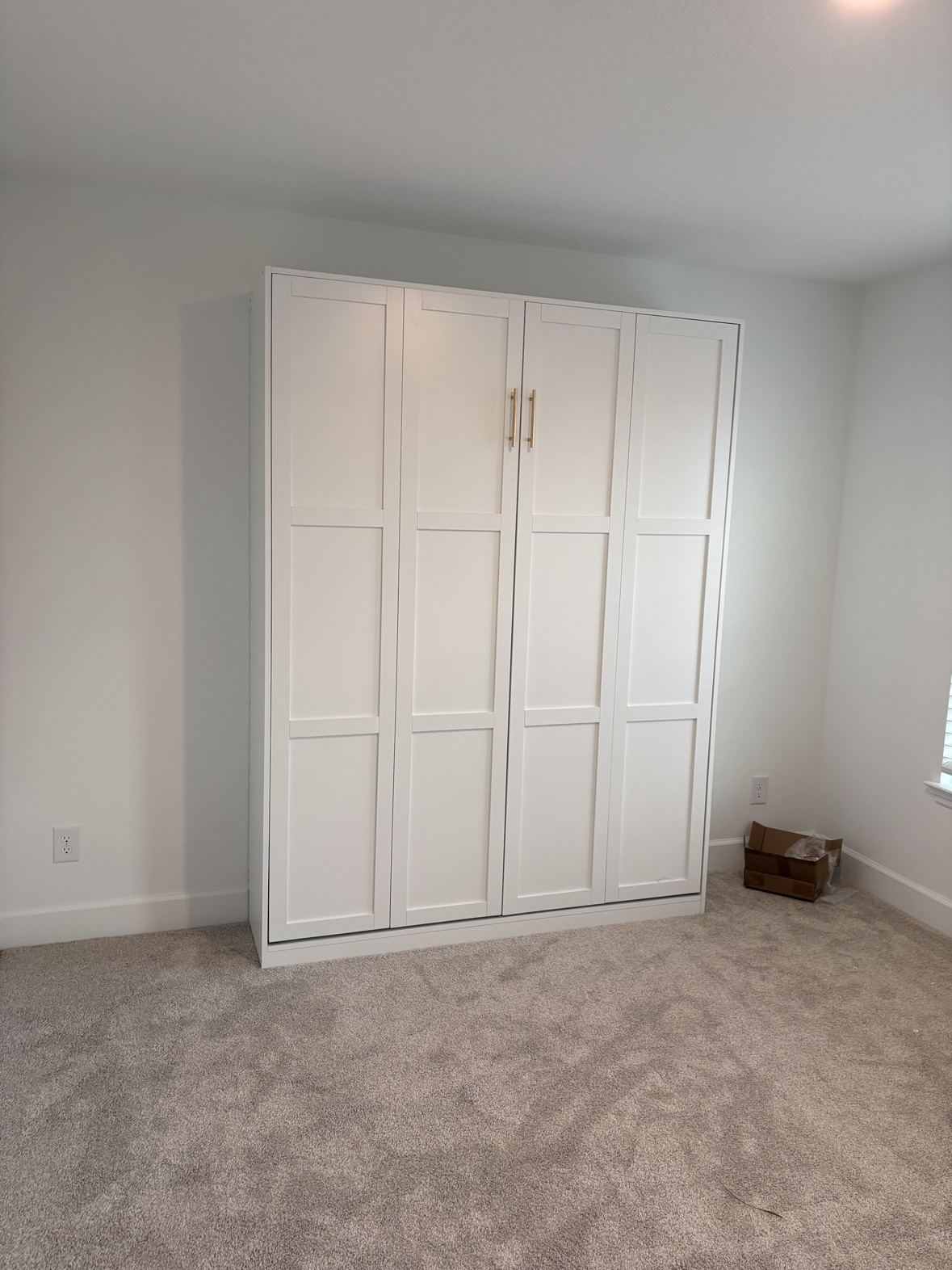 Finished white Murphy bed cabinet, closed